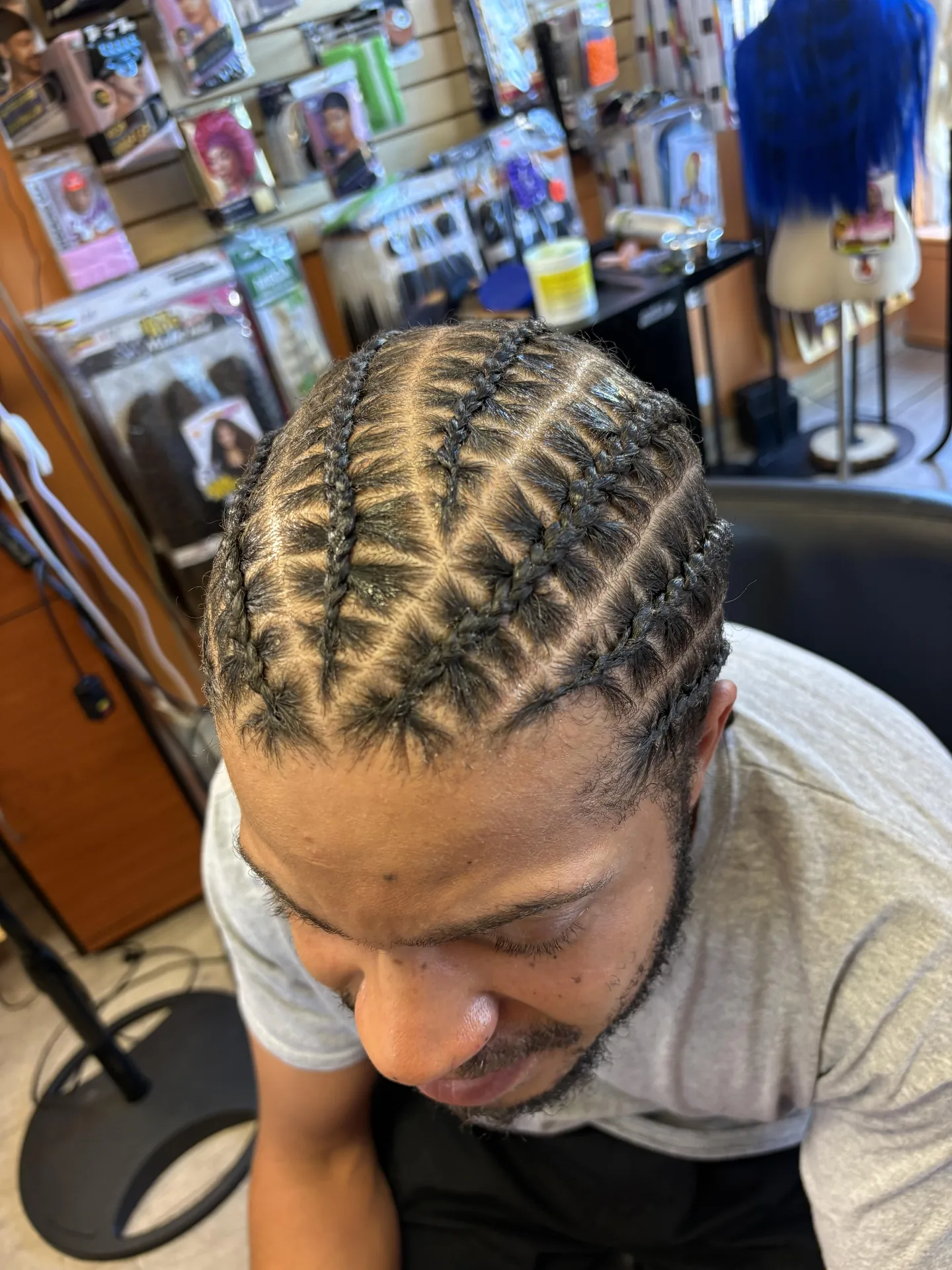 Precision Cornrows hairstyle by New Look Hair Salon in Attleboro MA